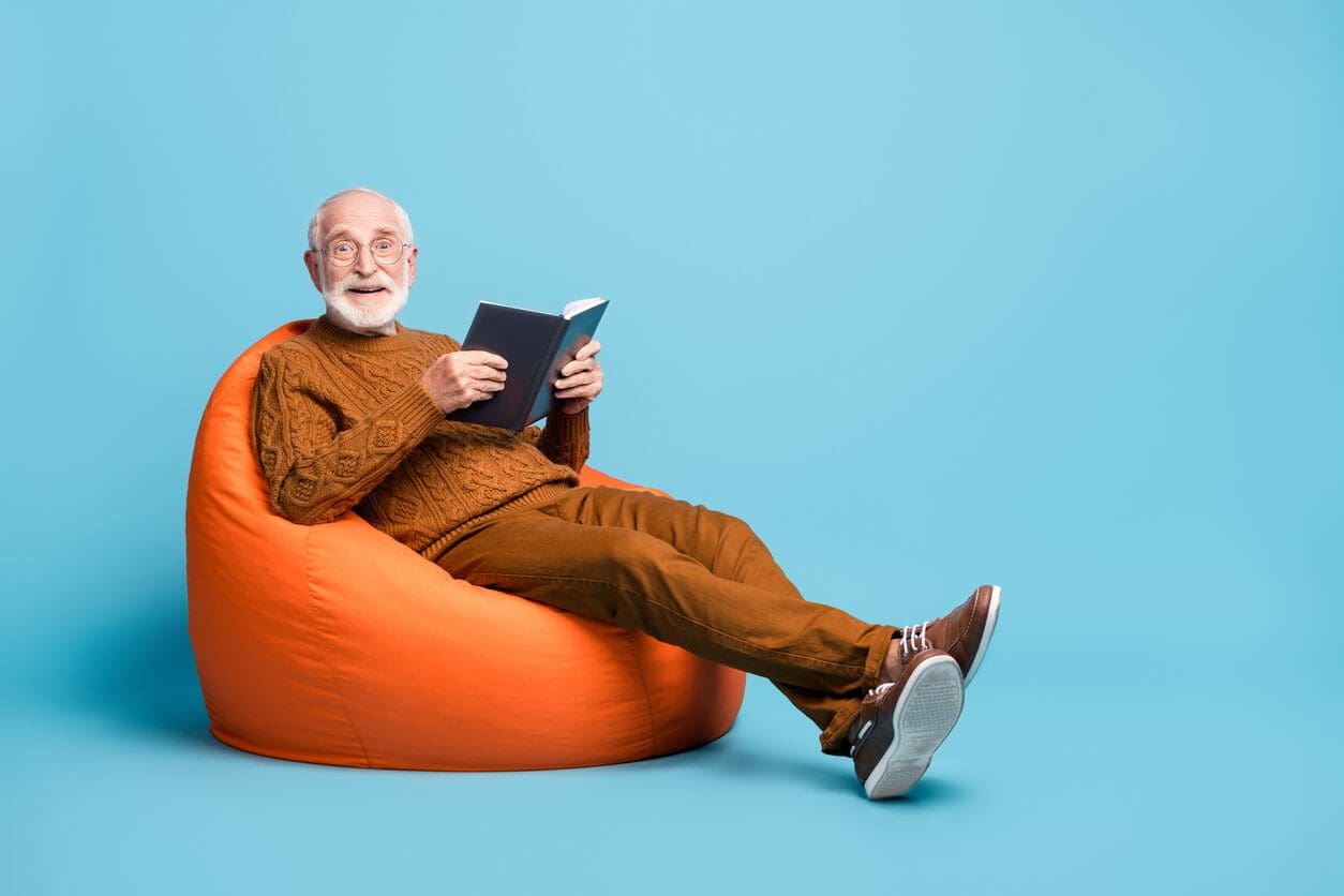 eldery man reading book